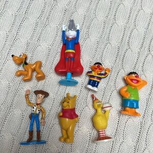 Toy lot. 7 plastic pcs. Big bird, bugs bunny, Woody, Pooh, 2 Ernie, Pluto.